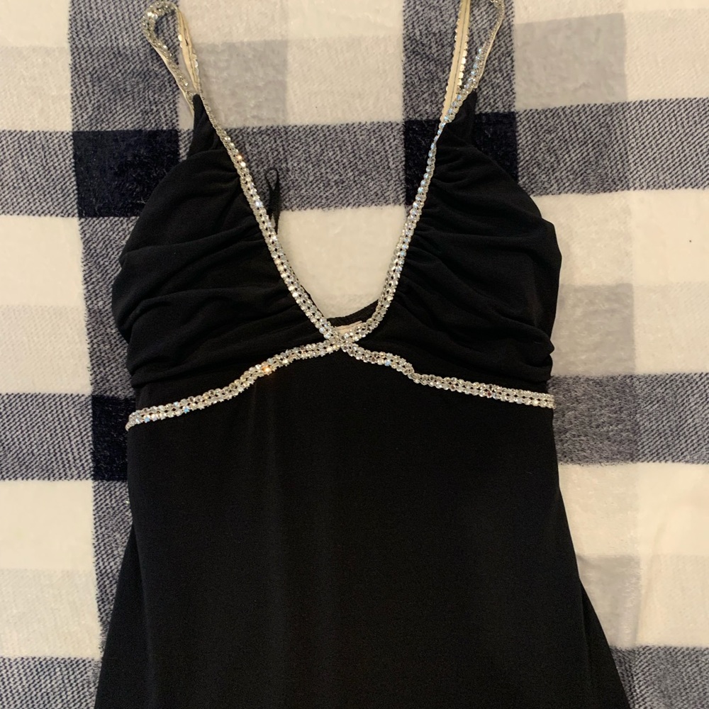 Black formal dress with simple rhinestone design.